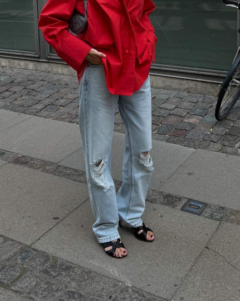 HOUSE OF DAGMAR Asymmetric shirt, The Row Soft Knot Slide Sandal and The Row Burty distressed straight-leg jeans worn by annabelrosendahl's closet