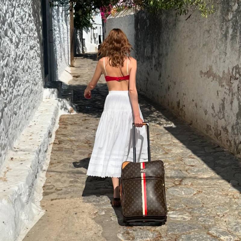 DOEN Sebastiane Tiered Cotton Maxi Skirt, TOD'S Boat Gommino Bubble in Leather and Louis Vuitton Suitcase Pegase Business NM Monogram 55 Brown in Toile Canvas worn by Alexa Chung | alexachung's closet