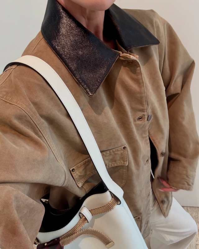 PRADA distressed canvas jacket and PRADA Buckle Leather Bucket Bag with Jeweled Belt worn by Rosie Huntington-Whiteley | Rosie HW Outfits and Style