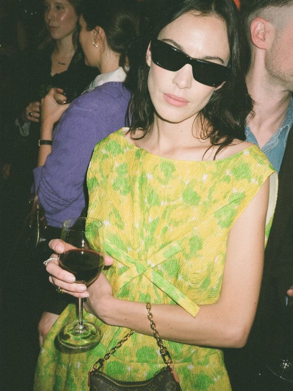 THISTLES The JACK — Black & Black, LOUIS VUITTON Nano Boulogne and PRADA floral-print bow-detail mini dress worn by Alexa Chung | Alexa Chung Outfits and Style