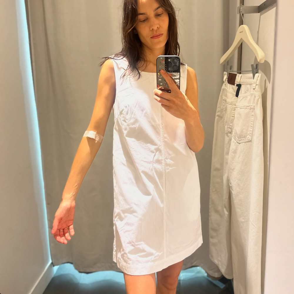 Calvin Klein Cotton Poplin Sleeveless Mini Dress worn by Alexa Chung | Alexa Chung Outfits and Style