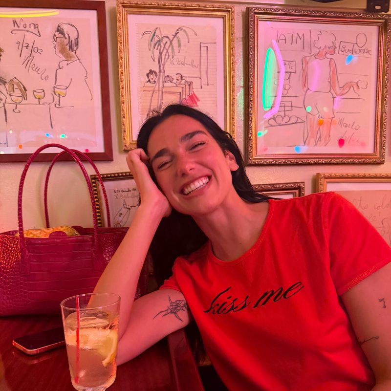 Marc Jacobs round-neck short-sleeve T-shirt and CHANEL Fall Winter 2026 Crocodile Embossed Shopping Bag worn by Dua Lipa | Dua Lipa Outfits and Style