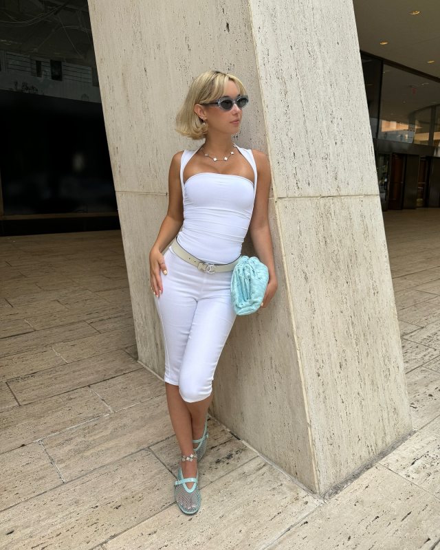 BOTTEGA VENETA Teen Woven Pouch Clutch, Classic oval sunglasses and ALAIA BALLET FLATS IN FISHNET as seen on Sarah Snyder @sarahfuckingsnyder