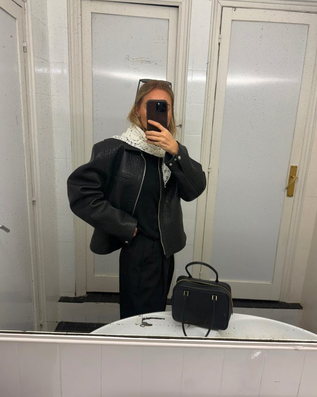 MAGDA BUTRYM Crochet scarf in cream, MAGDA BUTRYM Boxy embossed leather zip jacket in black and HERMES Plume mini bag worn by Claire Rose Cliteur | Claire Rose Cliteur Outfits and Style