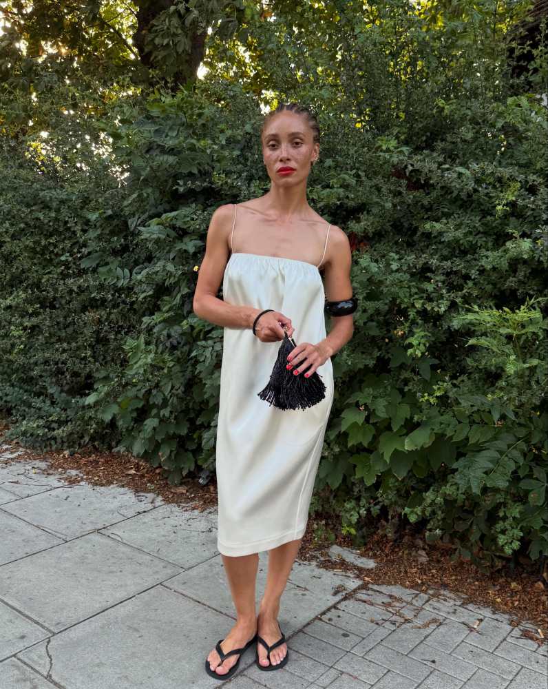 PHOEBE PHILO LIQUID SLIP DRESS and THE VEIL Mini Fountain Bag in Black worn by Adwoa Aboah | Adwoa Aboah Outfits and Style