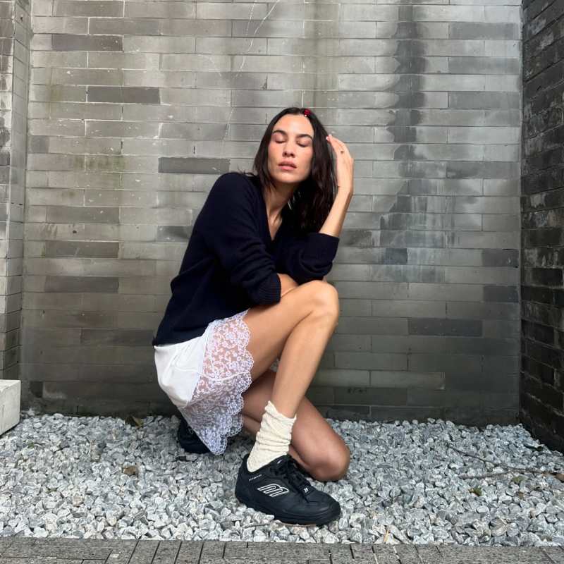 Balenciaga Women's Hamptons Worn-out Sneaker in Black and Simone Rocha White Deep Lace Trim Slip Minidress worn by Alexa Chung | Alexa Chung Outfits and Style