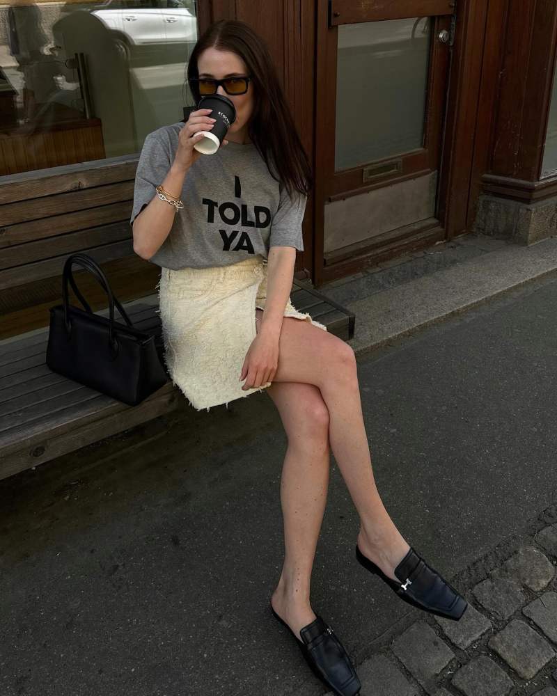 HERMES Groupie mule, THE ROW E/W Top Handle Bag in Leather and Acne Studios skirt worn by Annabel Rosendahl
 | annabelrosendahl's closet