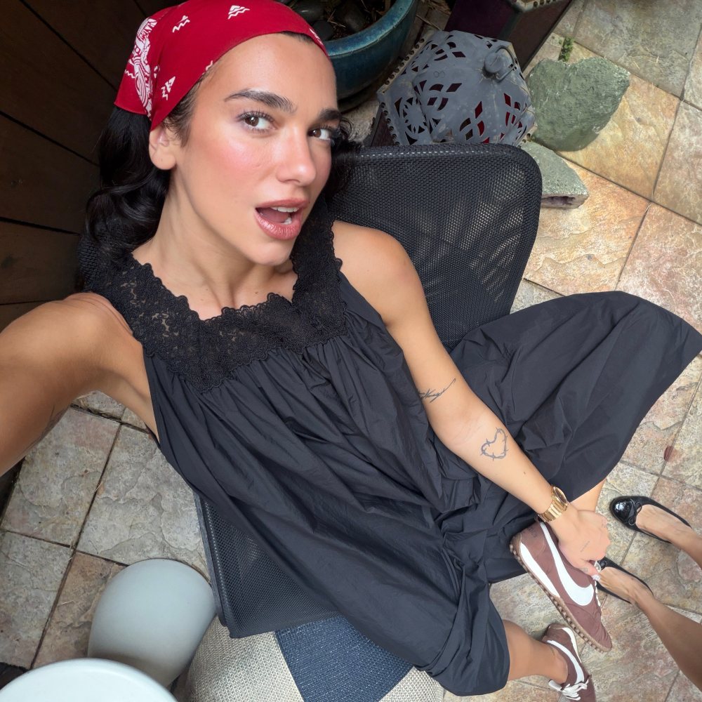 HELSA Midi Dress With Lace in Tech Poplin, BVLGARI Octo Finissimo 37 mm Watch and Moon Shoe Jacquemus + Nike worn by Dua Lipa | Dua Lipa Outfits and Style