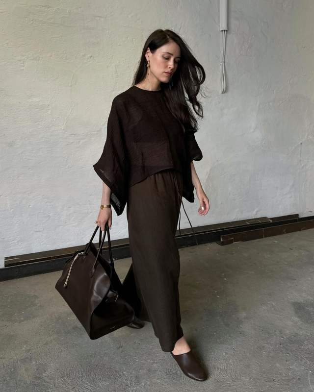 Khaite The Otto Leather Mules, THE ROW Soft Margaux 17 Bag, Massimo Dutti 100% LINEN CAPE WITH SLIT DETAIL and Massimo Dutti 100% WAFFLE-KNIT LINEN SKIRT worn by