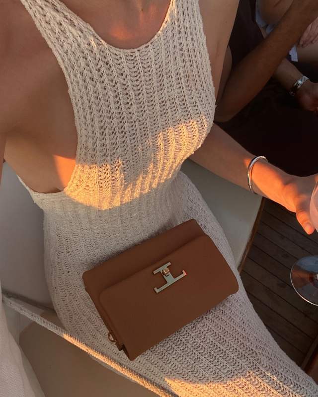Tod's knitted long dress and TOD'S T Timeless Flap Bag in Leather Mini as seen on Christie Tyler @christietyler