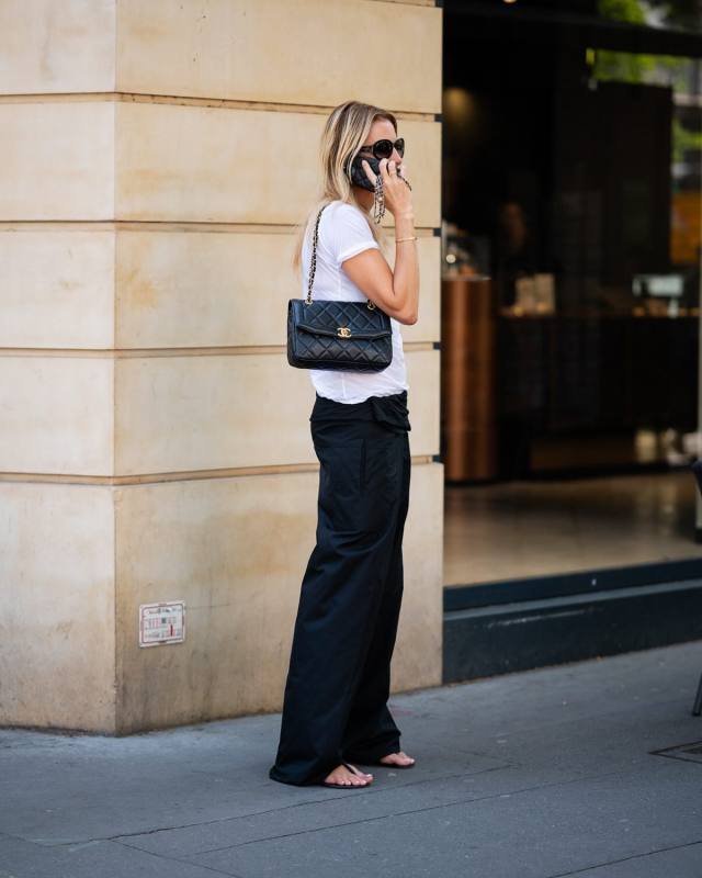 WARDROBE.NYC Fisherman tie-front wide-leg pants and Giuseppe Zanotti Tie flat leather sandals worn by Claire Thomson-Jonville | Claire Thomson-Jonville Outfits and Style