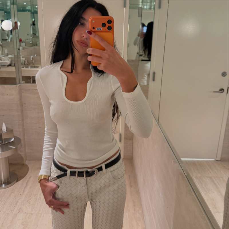 FERRAGAMO ribbed top with plunging neckline worn by Dua Lipa | Dua Lipa Outfits and Style