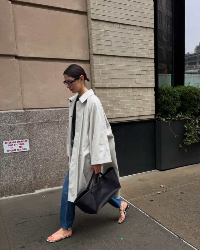PRADA Symbole sunglasses, Khaite Loop Snake-Embossed Leather Sandals, THE ROW Leinster Wide-Sleeve Coat and The Row Idaho XL leather tote worn by Chloe Pinchasick | Chloe Pinchasick Outfits and Style