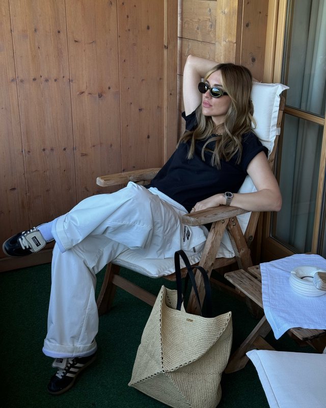 Balenciaga 3B Sports Icon track pants and LOEWE Puzzle Fold Tote in raffia as seen on Viky Rader @vikyrader