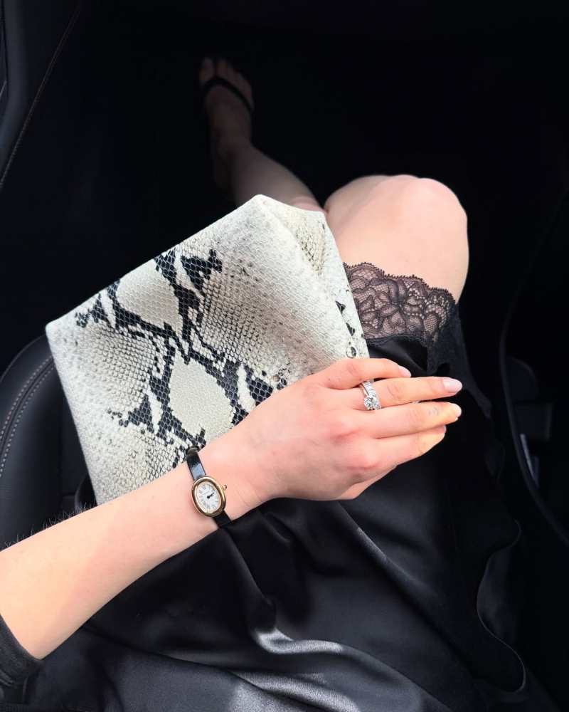The Row Irene lace-trimmed silk-charmeuse skirt and Khaite Bobbi snake-effect leather shoulder bag worn by Chloe Pinchasick | Chloe Pinchasick Outfits and Style