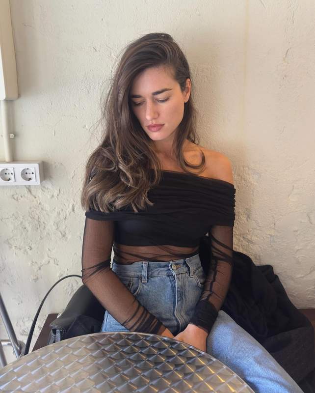 Christopher Esber Sheer off-the-shoulder silk top worn by Ilirida Krasniqi | Ilirida Krasniqi Outfits and Style