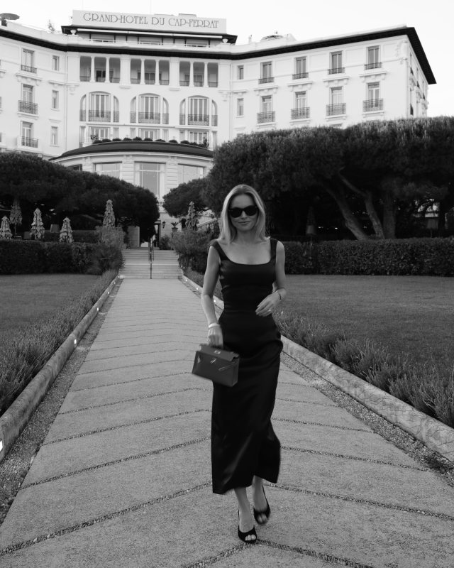 MAGDA BUTRYM Round neck midi dress in black and HERMES Kelly Bag worn by Claire Rose Cliteur | Claire Rose Cliteur Outfits and Style