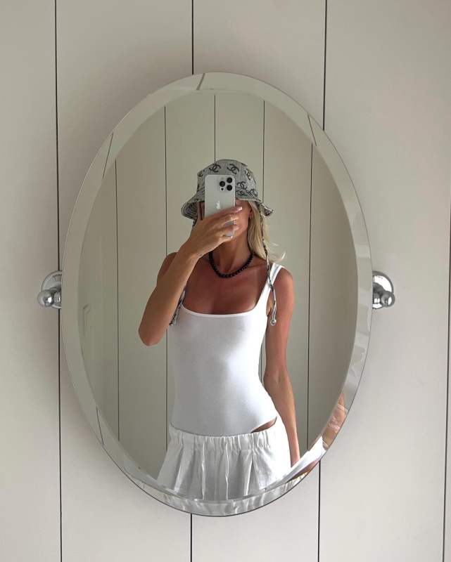 CHANEL Bucket Hat and FLORE FLORE NUR BODY Bodysuit worn by Lovisa Worge | lovisaworge's closet
