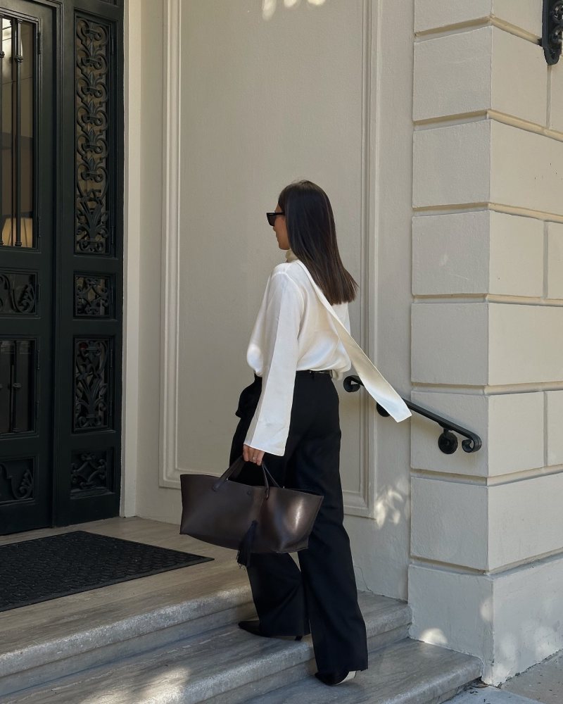 ROHE Silk Foulard Long-Sleeve Top, Khaite Arizona Boot and The Row Idaho XL leather tote worn by Şirin Haban | creativeecho's closet