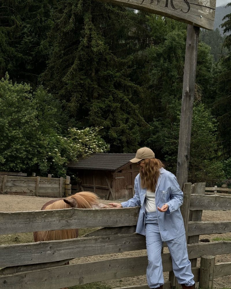 CELINE Logo-Embroidered Striped Cotton-Poplin Pyjama Shirt, CELINE Straight-Leg Striped Cotton-Poplin Pyjama Trousers and Saint Laurent cotton baseball cap as seen on Viky Rader