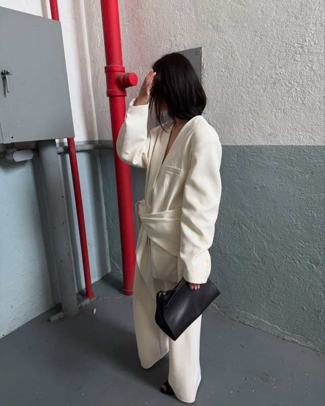 The Row Peggy Clutch Shoulder Bag in Saddle Leather worn by Mimi Nguyen | Mimi Nguyen Outfits and Style