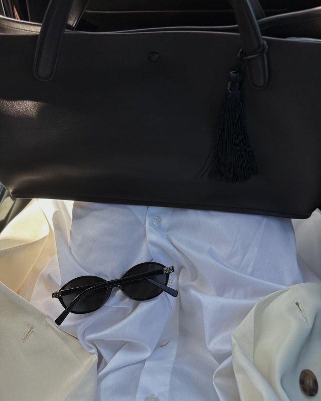MIU MIU logo-lettering oval sunglasses and The Row Idaho XL leather tote worn by Şirin Haban | creativeecho's closet