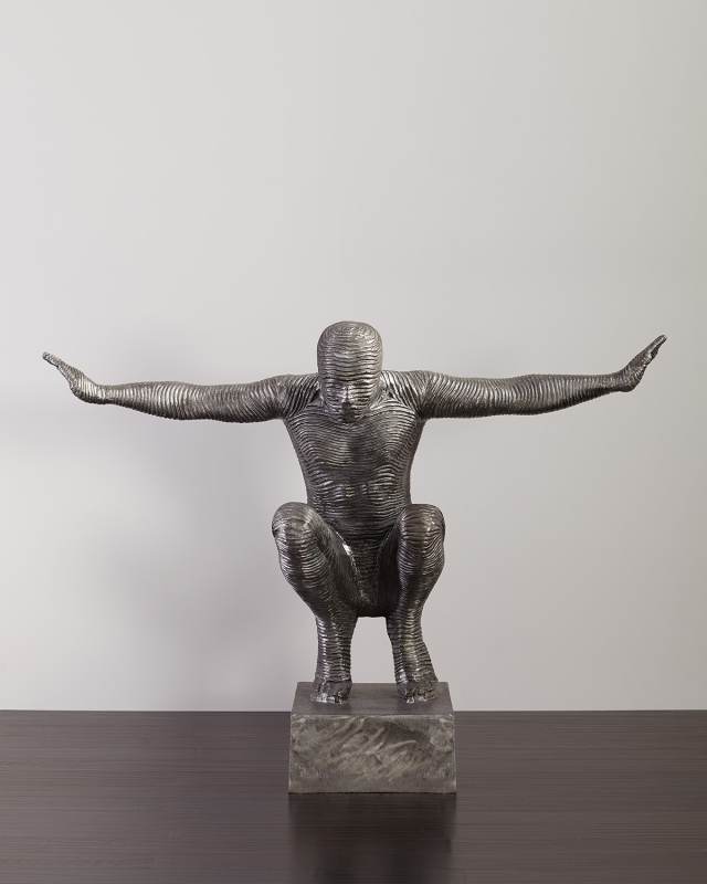 Squatting Man Sculpture