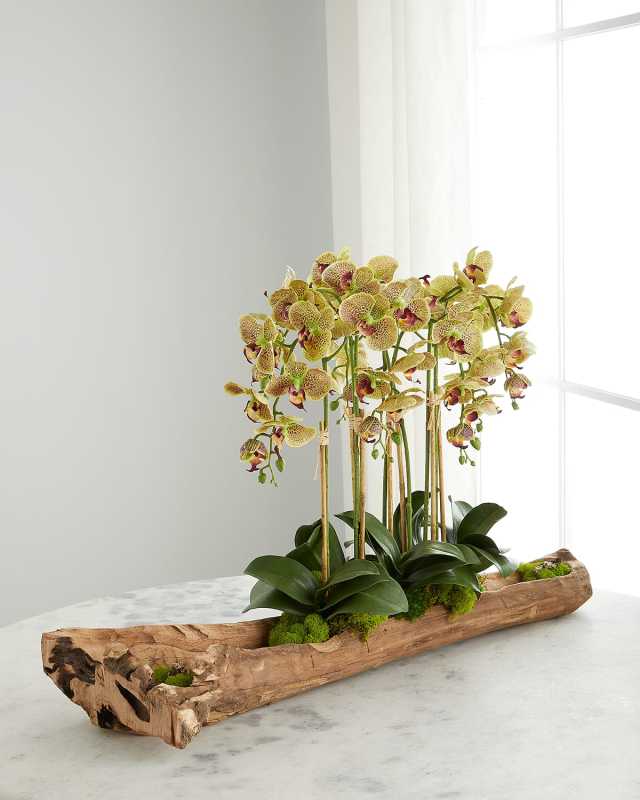 Log Filled with Faux White Orchids