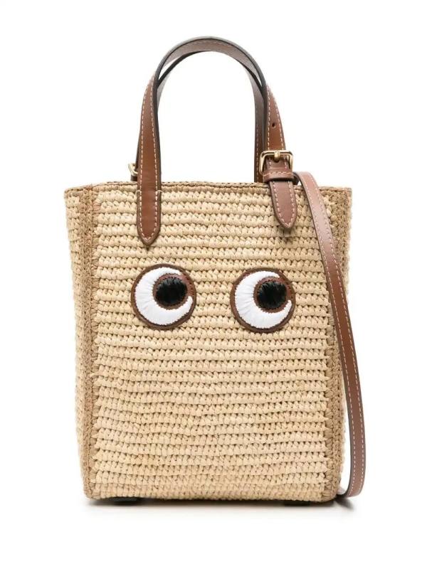 Eyes-embroidered raffia tote bag